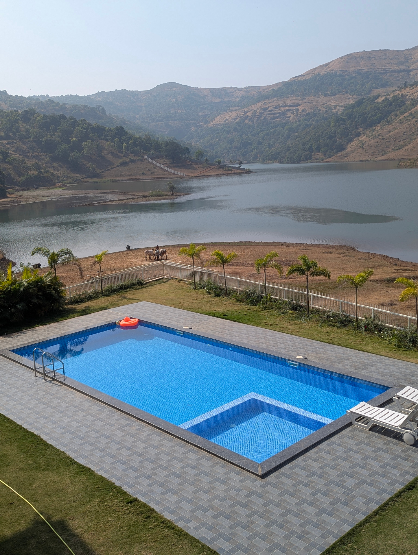 Pool contractor — Lakefront villa swimming pool with mountain & lake views by Dreamz Pools