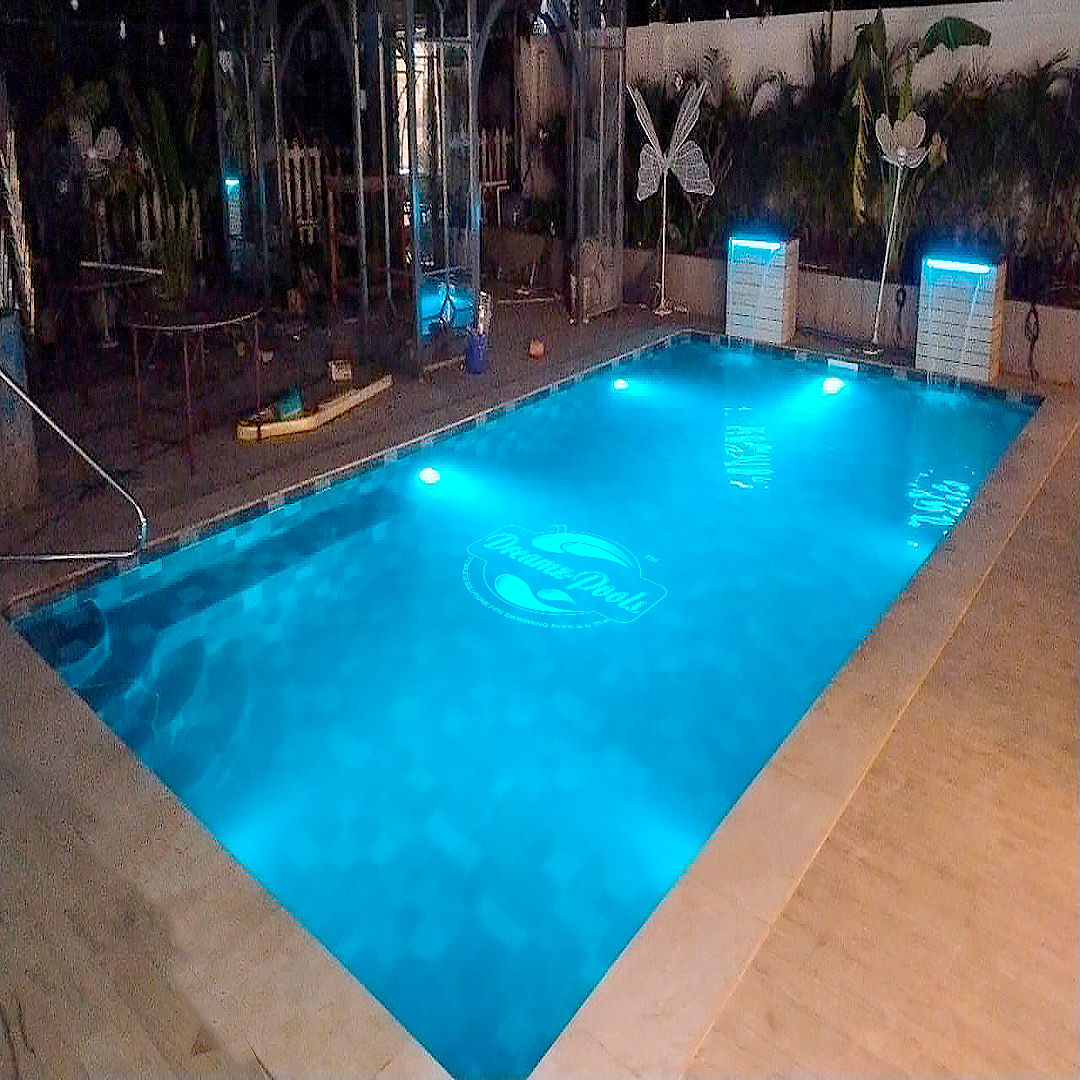 Pool contractor — Night-lit mosaic pool with LED illumination by Dreamz Pools